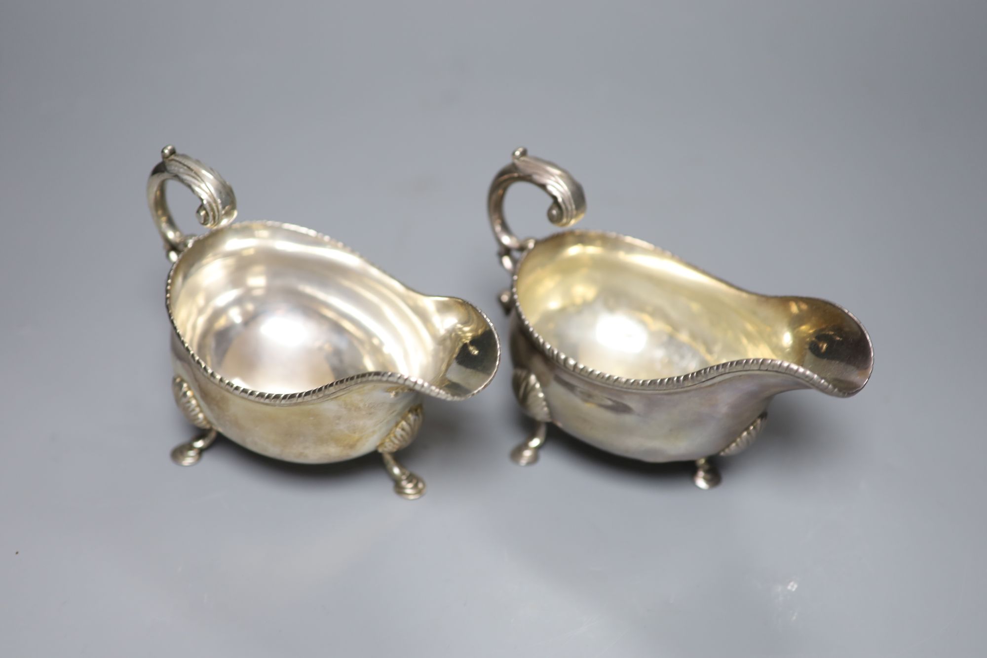 A pair of George III silver sauceboats, London, 1764?, marks rubbed, length 16.5cm, 15.5oz.